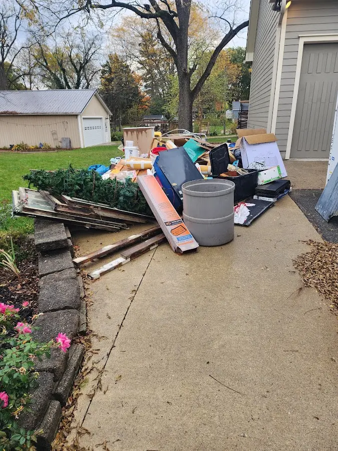 Dumpster being loaded with debris for Estate Cleanout Dumpster Rental in Strasburg